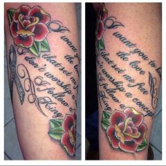 Lyrics and Roses forearm tattoo