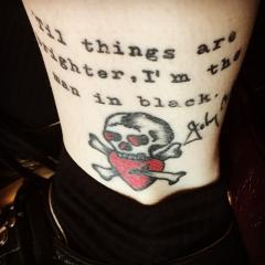Johnny Cash lyrics and signature and Sailor Jerry skull with heart